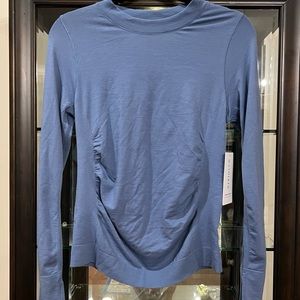 NWT Athleta Foresthill Ascent top. Cottage blue. Size Medium.